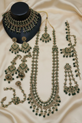 Green Shadow Bridal Set on Cream Gold Background